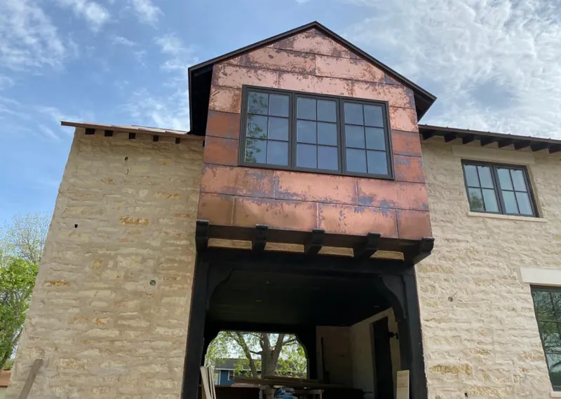 Copper metal panel facade on a stone building for Skylight Installation in Phoenixville